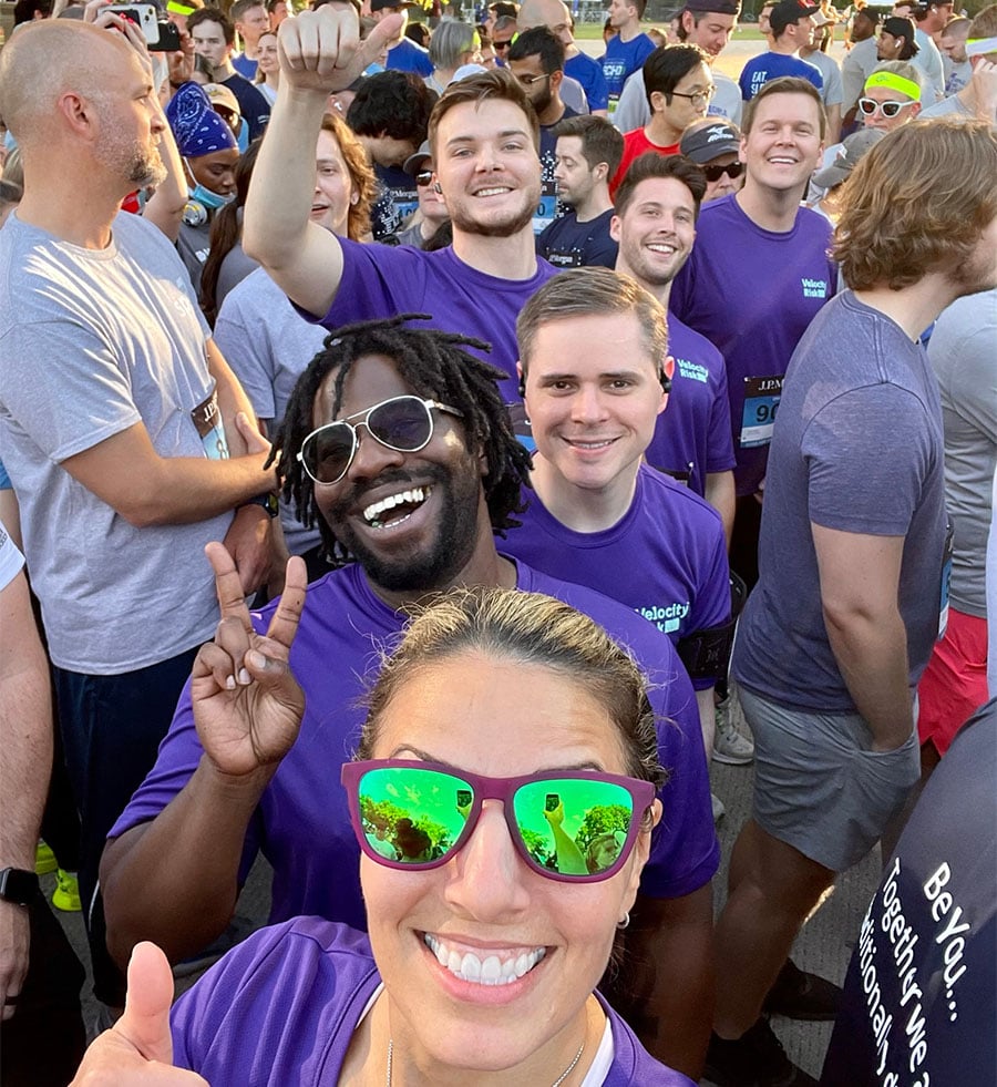 Velocity Risk team selfie in matching shirts