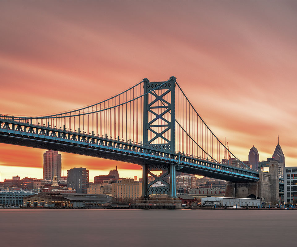 Skyline view of Ben Franklin Bridge in Philadelphia, Pennsylvania at sunset